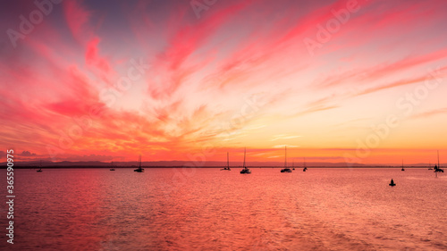 sunset over the sea at Scarborough Marina Queensland with boats in the foreground