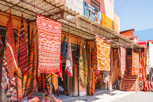 Carpets hanging outside a shop