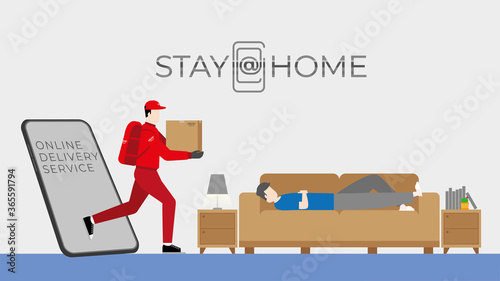 Stay at home. Lifestyle concept. The man in sleepwear sleeping on the sofa while a deliveryman and parcel box get through mobile phone