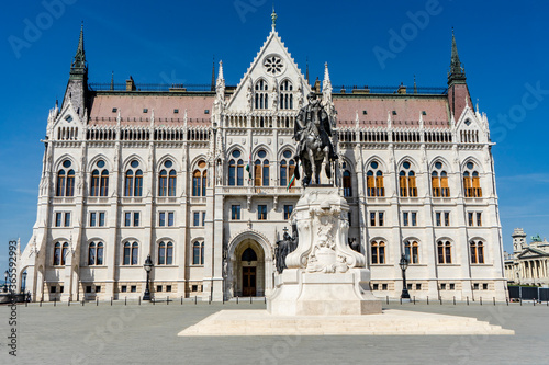 The Parliament building and a statue of Gyula Andrássy in Budapest