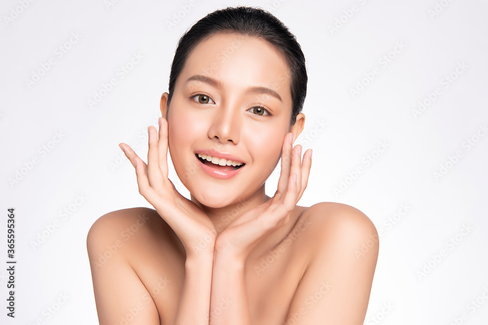 Beauty face. Smiling asian woman touching healthy skin portrait. Beautiful happy girl model with fresh glowing hydrated facial skin and natural makeup on white background, Beauty face. Smiling asian woman touching healthy skin portrait. Beautiful happy girl model with fresh glowing hydrated facial skin and natural makeup on white background,
