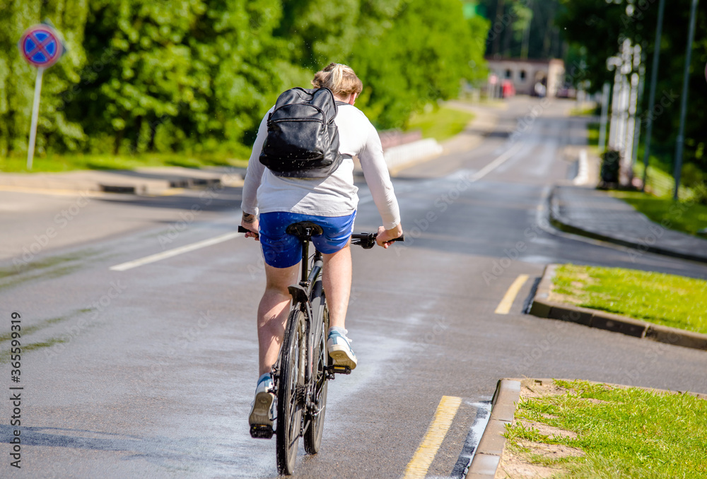 Fototapeta premium Cyclist ride on the bike path in the city Park 