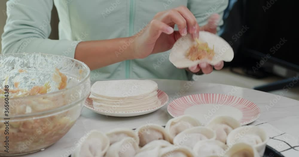 Woman making meat dumpling at home Woman making meat dumpling at home