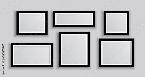 six wall photo frames in different sizes
