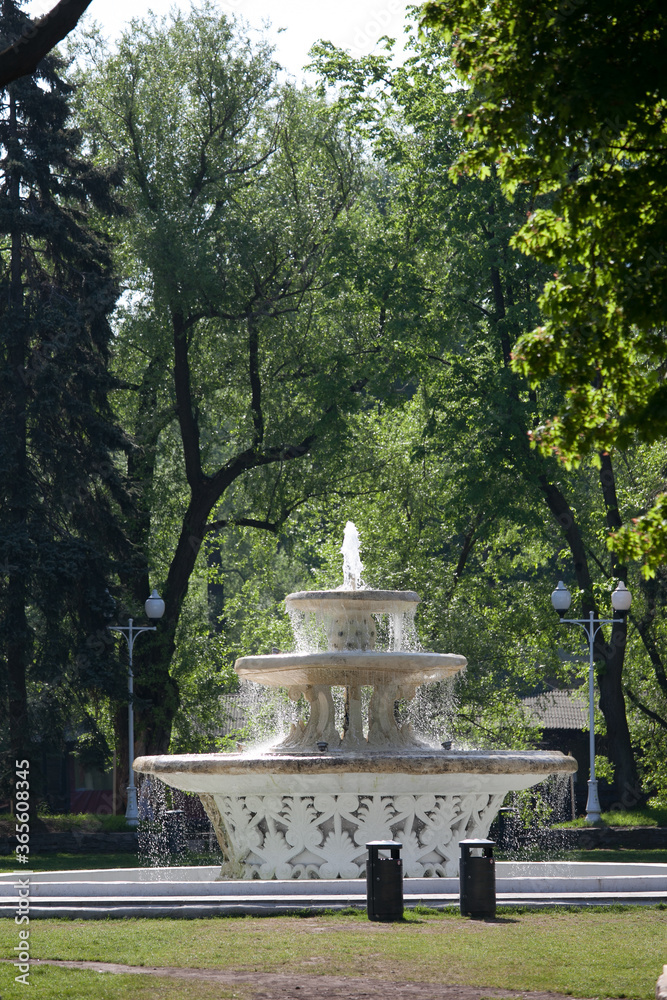 three-level white fountain in a green park
three-level white fountain in a green park