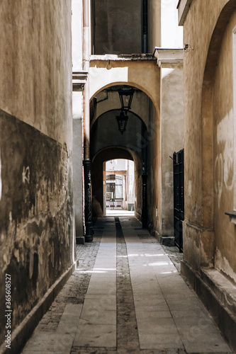 motley narrow street arch in europe © KseniyaK
