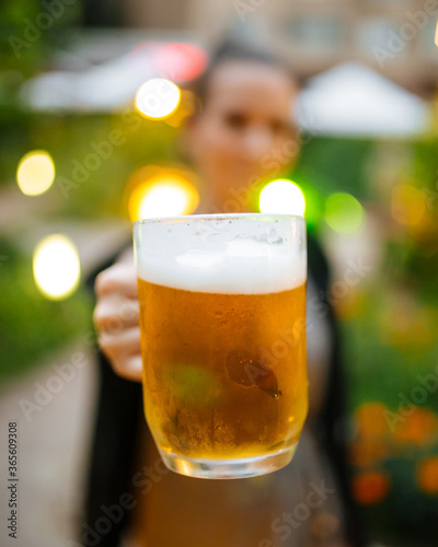 Mug beer holding female waiter blurry background