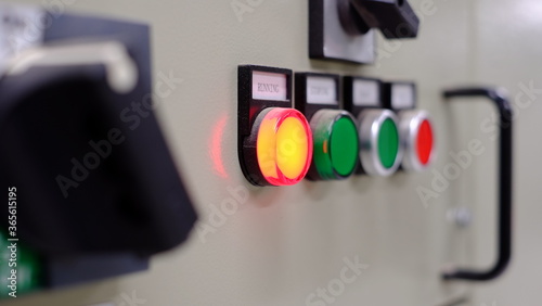 Electrical part and accessories in the  control cabinet , control and power distributor,lockout ,tagout.Focus is first red pilot lamp