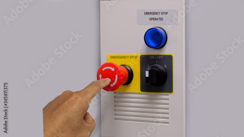 Electrical part and accessories in the  control cabinet , control and power distributor,lockout ,tagout. Emergency push stop buttom and selector switch on cablinet photo