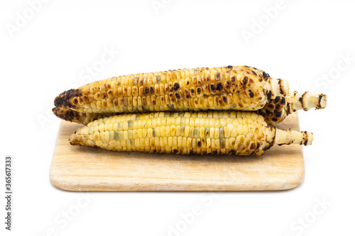 Organic Grilled Corn on the cob with isolated on white background.