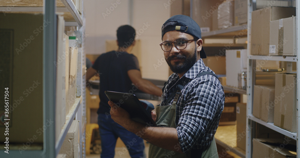 Young man working in distribution center Young man working in distribution center