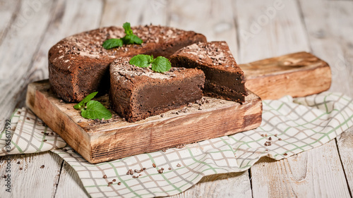 Food banner format. Chocolate brownie dessert. Homemade chocolate cake on a light wooden background. Cooking delicious desserts at home