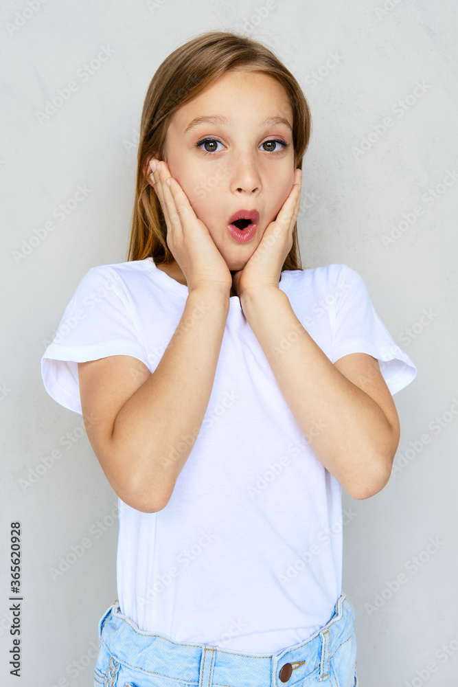 Young sportive girl with hands on cheeks Young sportive girl with hands on cheeks