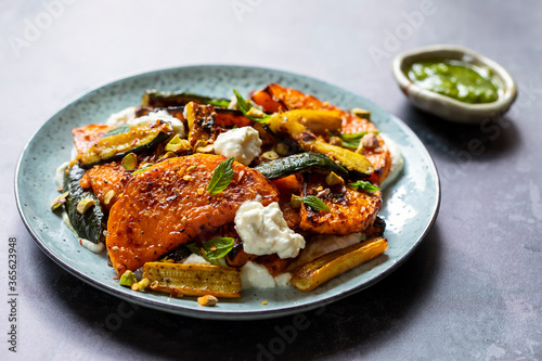 Roast butternut squash and courgettes with feta and yougurt sauce