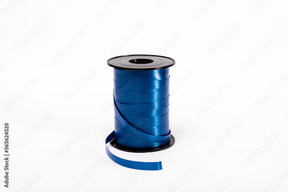 coil of blue ribbon for decoration isolated on white background coil of blue ribbon for decoration isolated on white background