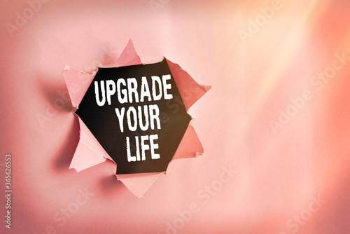 Word writing text Upgrade Your Life. Business photo showcasing improve your way of living Getting wealthier and happier Rolled ripped torn cardboard placed above a wooden classic table backdrop photo