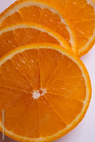 sliced citruses on white 