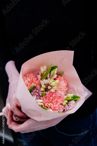 Fototapeta Naklejka Na Ścianę i Meble -  Bouquet of flowers in pink package