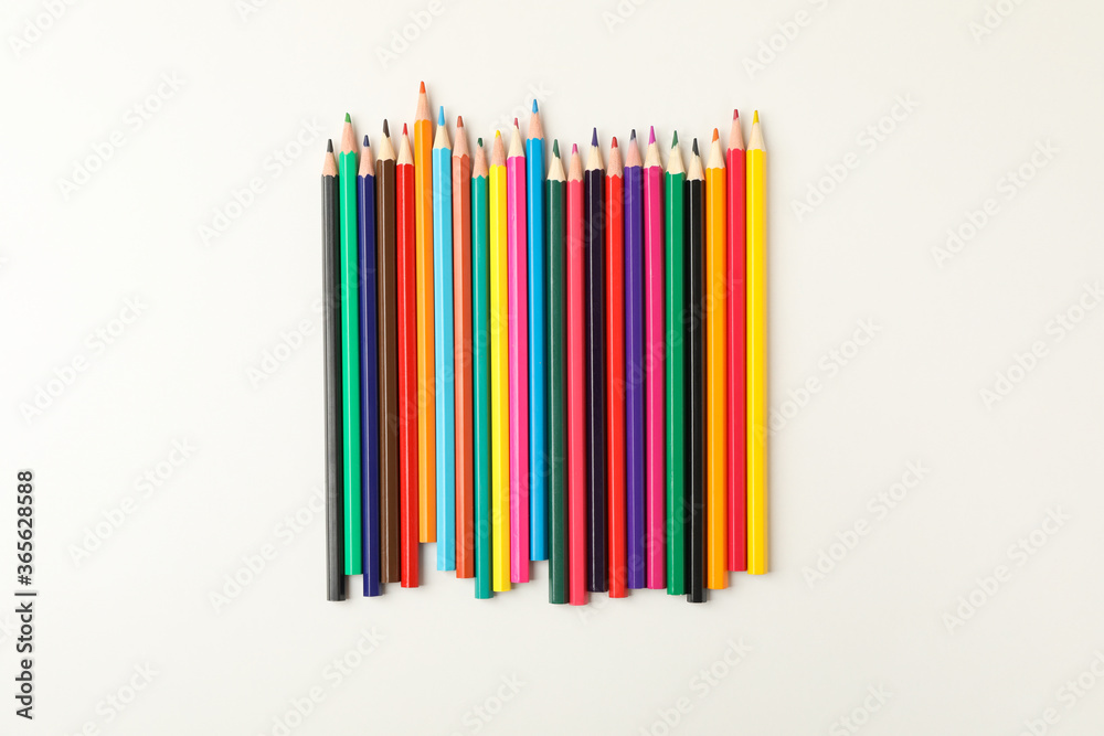 Colorful pencils on white background, top view Colorful pencils on white background, top view
