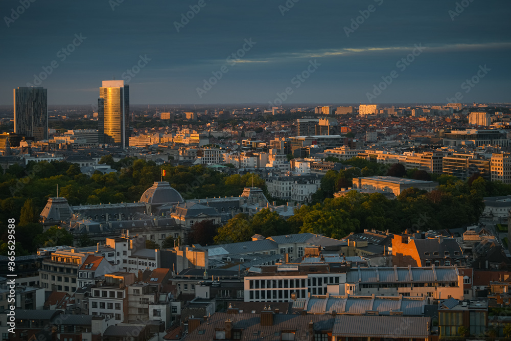 Amazing summer sunset top view over Royal Palace in Brussels with lovely light and the flag of Belgium on top of the builidng