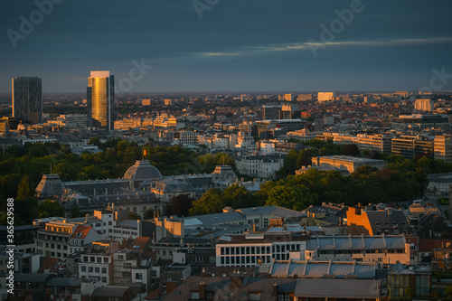 Amazing summer sunset top view over Royal Palace in Brussels with lovely light and the flag of Belgium on top of the builidng
