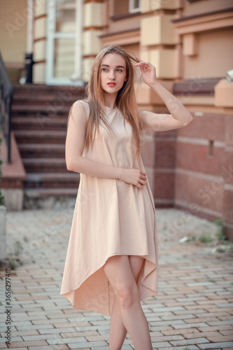 portrait of young woman posing on the street