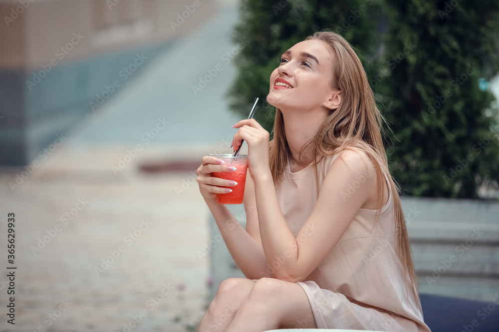 Outdoor fashion beauty portrait of glamour elegant lady, amazing long hairs, drinking tasty cold cocktails, city cafe terrace, travel, joy, relax.