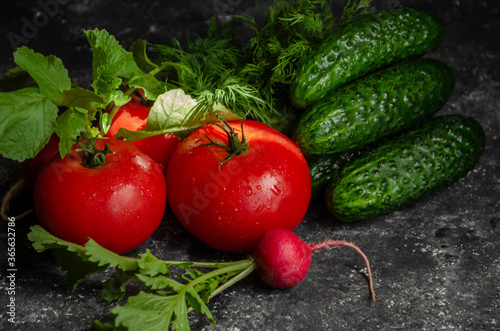 radish with tomatoes on a black background