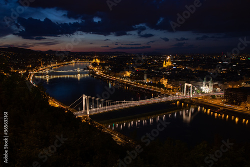 Beautiful midnight scene in the lovely Budapest with the Danube and the Elizabeth Bridge with the Chain Bridge in the background