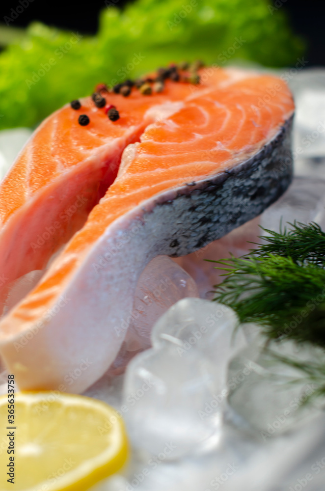 red fish steak on ice with herbs and spices red fish steak on ice with herbs and spices