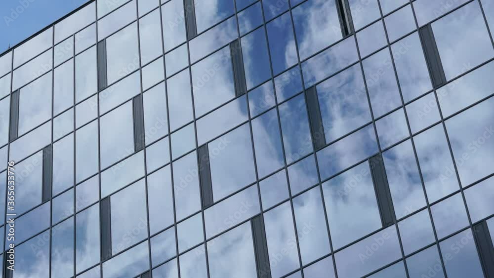 white clouds float in blue sky reflecting in large local skyscraper panoramic windows on summer day time lapse white clouds float in blue sky reflecting in large local skyscraper panoramic windows on summer day time lapse