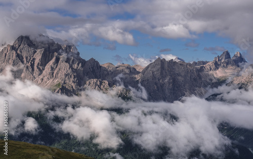 Unusual view of the Sesto Dolomites in Italy wrapped in clouds from top to bottom as seen from Carnic Peace Trail from Sillianer refuge to Obstansersee refuge on top of the Carnic Alps ridge, Austria. © MoVia1