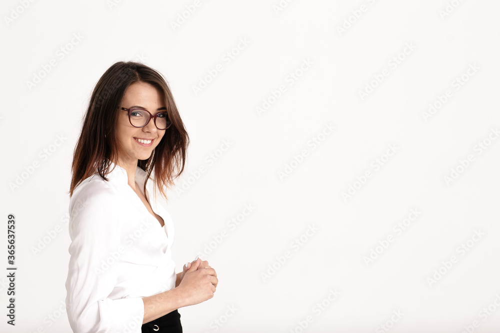 Pretty adult smile and show glasses standing over white background in studio. Pretty adult smile and show glasses standing over white background in studio.