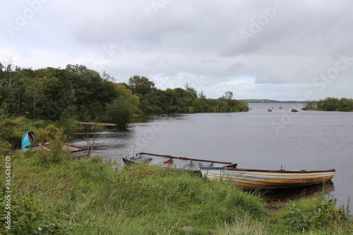 Old rowing boats abandoned on the shore of Lough Mask, County Mayo Ireland.