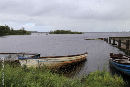 Old rowing boats abandoned on the shore of Lough Mask, County Mayo, Ireland.