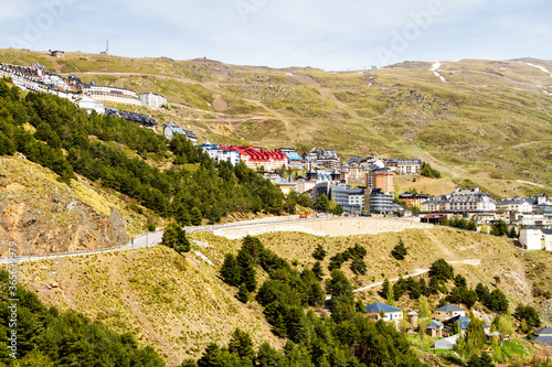 PRADOLLANO, SPAIN - MAY 4, 2017: Town of Pradollano in Sierra Nevada mountains in Spain is a popular tourist destination and winter ski resort. photo