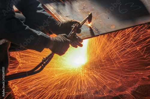 Cutting metal plate with oxygen. Oxy-fuel welding (commonly called oxyacetylene welding, oxy welding, or gas welding in the United States) and oxy-fuel cutting are processes.