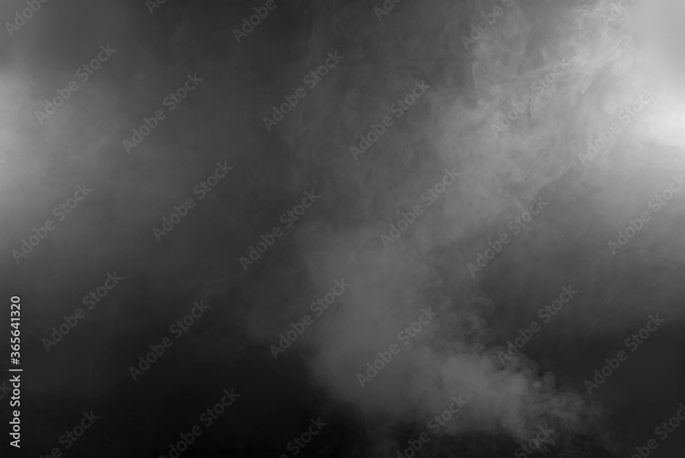 White smoke on a black background. The texture of scattered smoke. Blank for design. Layout for collages. White smoke on a black background. The texture of scattered smoke. Blank for design. Layout for collages.