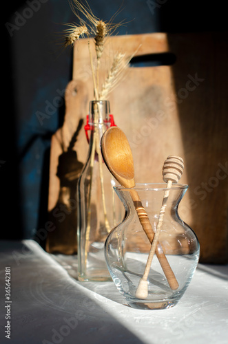 wooden cutlery in a glass vase stand on the table