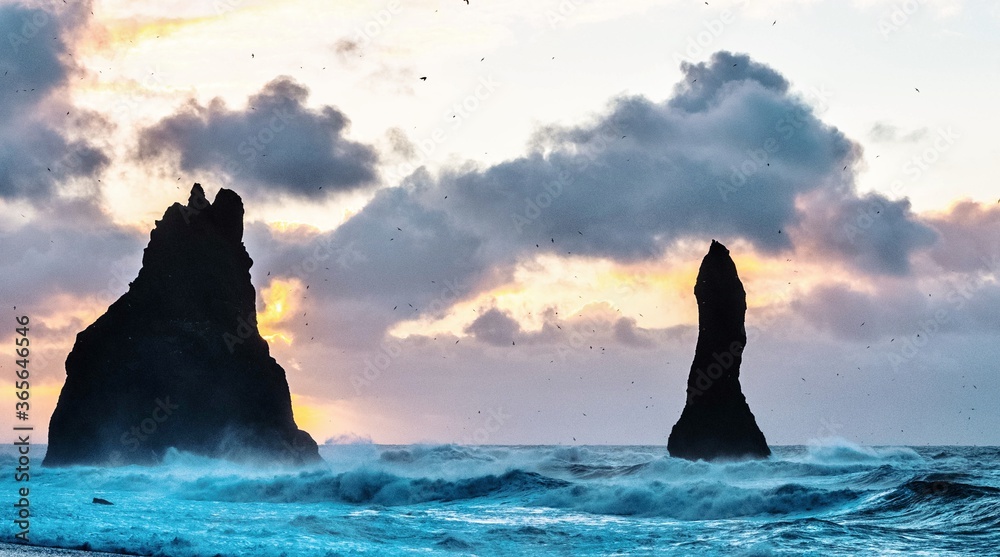 The rocks of Reynisdrangar from the volcanic beach of Reynisfjara, in Vik, Iceland