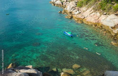Tropical island summer vacation, snorkeling in turquoise clear water sunny day, Koh Tao island popular destination for travel holidays in Thailand