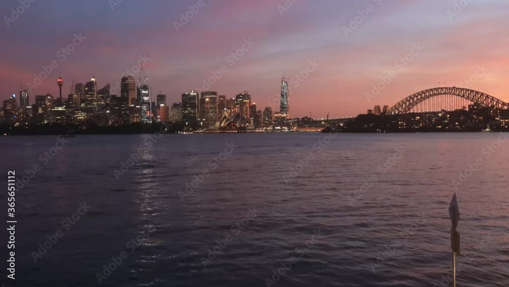 Sunset in Sydney city across harbour – major CBD landmarks 4k time lapse.
Sunset in Sydney city across harbour – major CBD landmarks 4k time lapse.