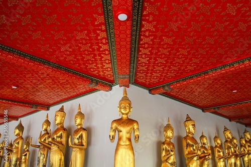 Golden statues in Wat Phra Chetuphon Vimolmangklararm Rajwaramahaviharn, Bangkok, Thailand photo