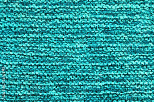 Blue-green background, homemade wool knitted texture