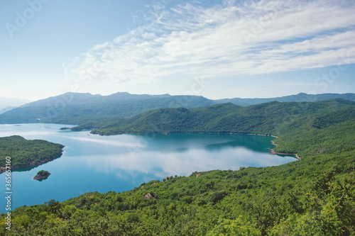 Picturesque blue lake among green mountains. Montenegro, Niksic, view of the Salt Lake