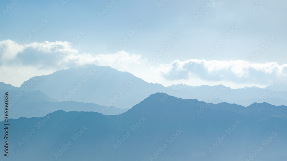 Fototapeta premium Beautiful silhouettes of mountain peaks at sunrise