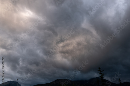 storm clouds over the mountains and small birds in a dark sky, slovakia tatras