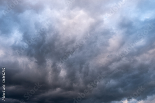 storm clouds over the mountains and small birds in a dark sky, slovakia tatras