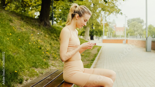 Young attractive woman using phone in city. Free Download Young attractive woman using phone in city. - GFXLoad