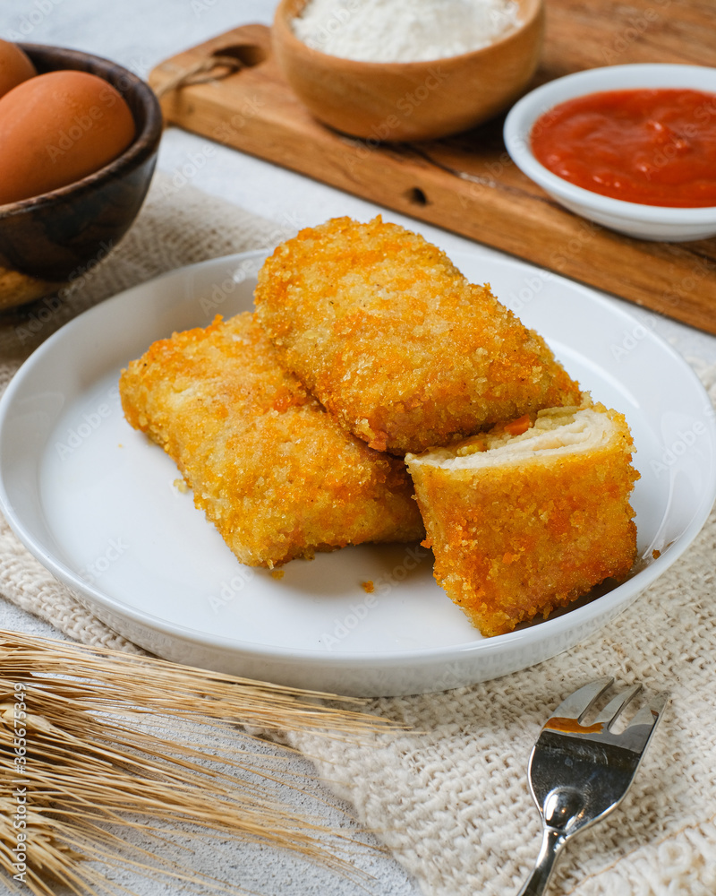 Delicious Risoles or Risol Mayo is a typical Indonesian traditional street food made from flour skin, meat and vegetables stuffing inside with mayonnaise and chili sauce. Delicious Risoles or Risol Mayo is a typical Indonesian traditional street food made from flour skin, meat and vegetables stuffing inside with mayonnaise and chili sauce.